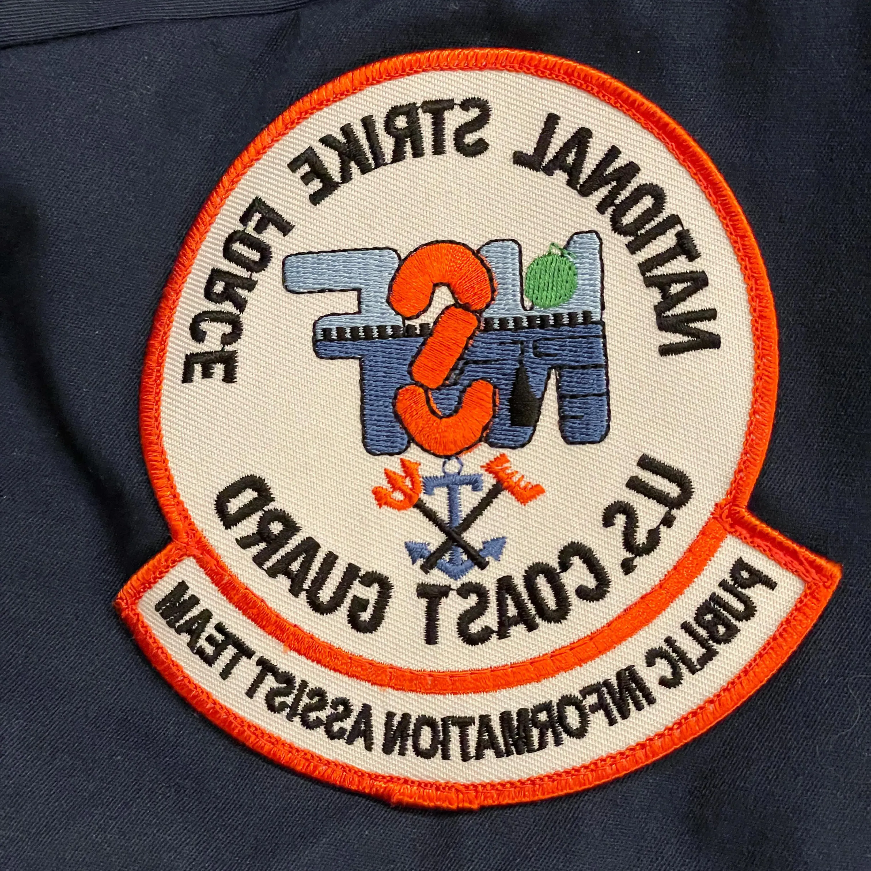 badge for uniform that says "National Strike Force U.S. Coast Guard. Public Information Assist Team"